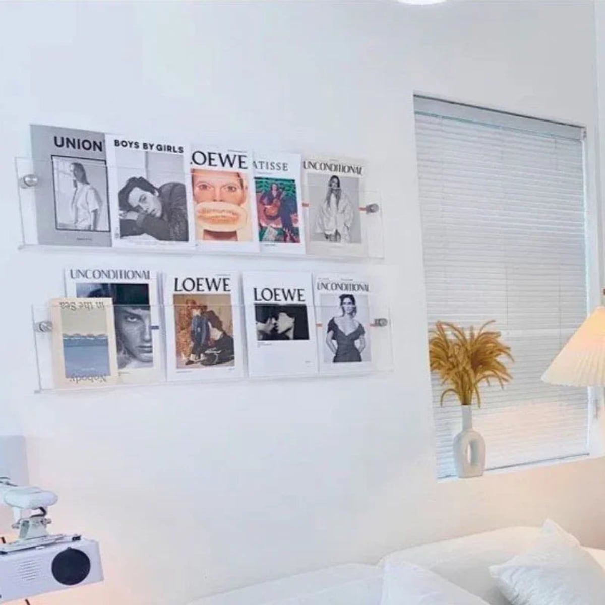 wall-mounted magazine and book display shelf in transparent