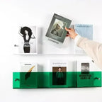 wall-mounted magazine and book display shelf in green