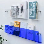 wall-mounted magazine and book display shelf in blue